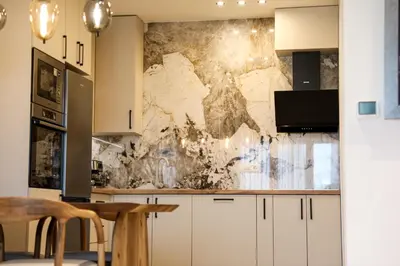 a kitchen with a map on the wall at Luxury Palata Penthouse Apartments in Banja Luka