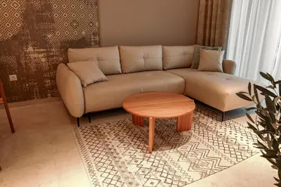 a living room with a couch and a table at Luxury Palata Penthouse Apartments in Banja Luka