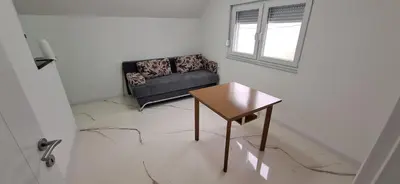 a living room with a couch and a table at Apartment Sikira in Visoko