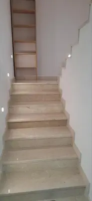 a staircase in a house with wooden steps at Apartment Sikira in Visoko