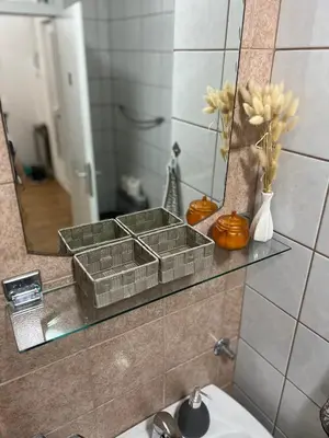 a bathroom with a sink and a mirror at Tajni kutak in Bosanska Gradiška