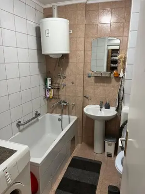 a bathroom with a bath tub and a sink at Tajni kutak in Bosanska Gradiška