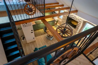 an overhead view of a spiral staircase with a wheel at Apartman Rustic Charm in Livno
