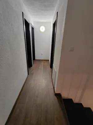 a hallway with two doors and a wooden floor at Divanhana na Uni in Bosanska Krupa