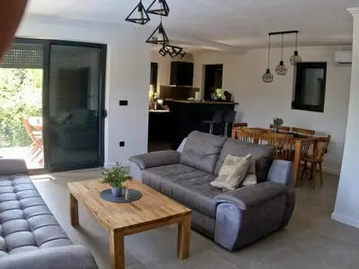 a living room with a couch and a table at Vikend kuća Ljetni San in Gračanica