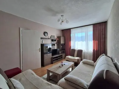 a living room with a couch and a table at Na korak do Vrbasa - blizu centra in Banja Luka