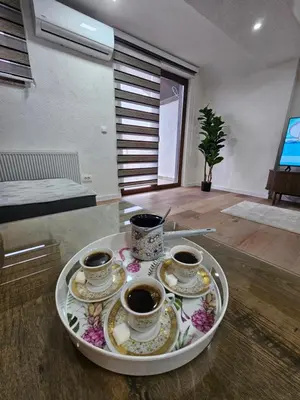 a tray with three cups of coffee on a table at Visoko Luxury Residence in Biskupići