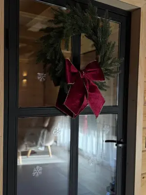 a wreath on a door with a red bow at Villa Alba in Kupres