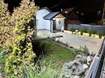 a backyard view of a house with a driveway at HH Lakes Tuzla - city center, free parking! in Tuzla