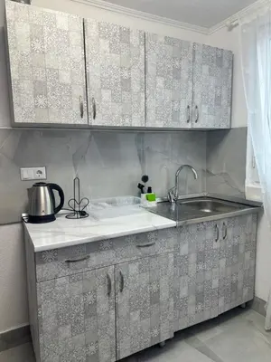 a kitchen with a sink and a counter top at HH Lakes Tuzla - city center, free parking! in Tuzla