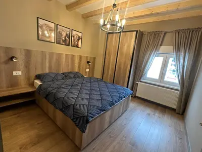 a bedroom with a bed and a window at Mountain house Mia Tereza in Kupres