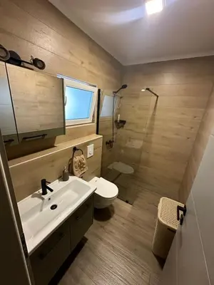 a bathroom with a sink and a toilet and a shower at Mountain house Mia Tereza in Kupres