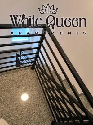 a sign for the white canyon pavilion at the canadian pavilionietyiety at White Quenn Apartments in Sanski most