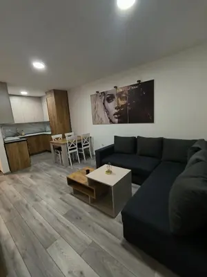 a living room with a couch and a table at Apartman Prijedor in Prijedor