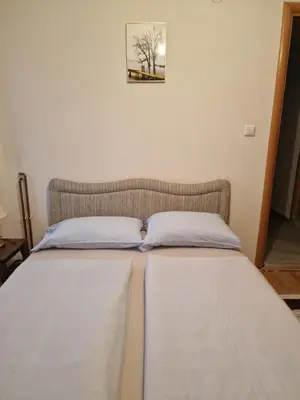 two beds sitting next to each other in a room at Deya in Kupres