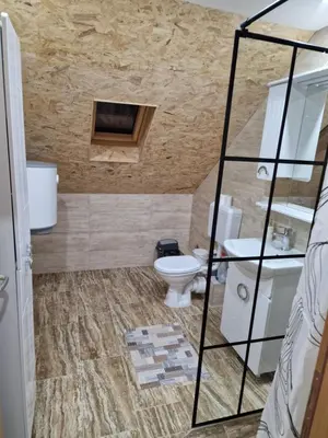 a bathroom with a toilet and a sink at Deya in Kupres