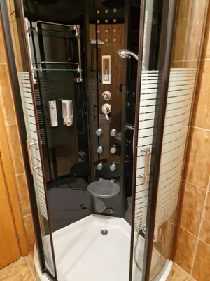a bathroom with a shower and a toilet at Deya in Kupres