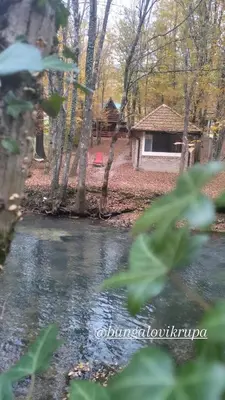 a view of a river with a house in the background at Bungalovi Krupa in Banja Luka