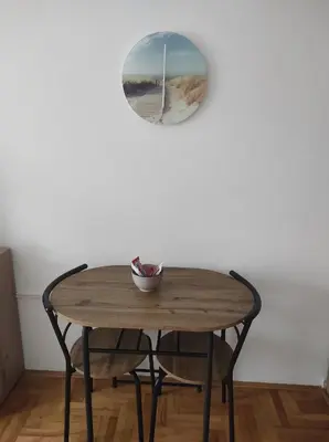 a table with a bowl on top of it next to a mirror at Studio Maja in Banja Luka