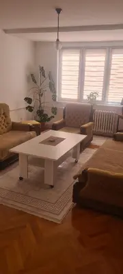 a living room with a coffee table and a couch at All app in Travnik