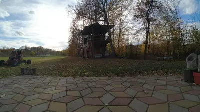 a park with a playground and a bird house at Red Brick Guest House