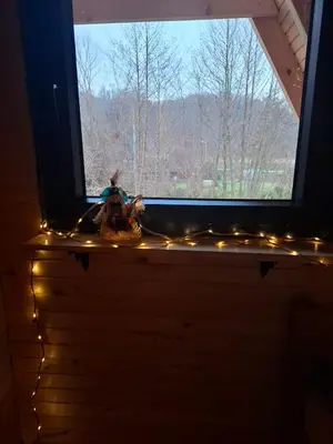 a window with christmas lights in a room at Red Brick Guest House