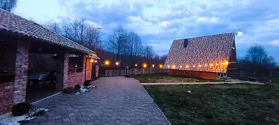 a building with lights on the side of it at Red Brick Guest House