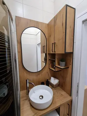 a bathroom with a sink and a mirror at Apartman Nina in Banja Luka