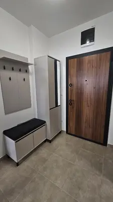 a room with a wooden door and aasteryasteryasteryasteryasteryasteryasteryastery at Dana in Banja Luka