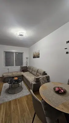 a living room with a couch and a table at Dana in Banja Luka