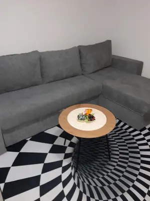 a living room with a couch and a table at Odmor za umorne in Banja Luka