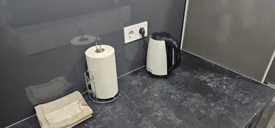 a kitchen counter with a blender and a towel at Apartman BINGO Bugojno in Bugojno