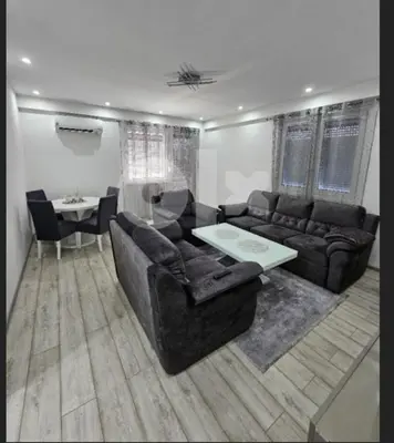 a living room with a couch and a table at Apartman BINGO Bugojno in Bugojno