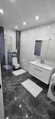 a bathroom with a toilet and a sink and a mirror at Apartman BINGO Bugojno in Bugojno