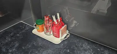 a shelf in a bathroom with food and condiments at Apartman BINGO Bugojno in Bugojno