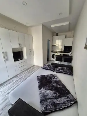 a large white room with two beds in it at Apartman Novak in Banja Luka
