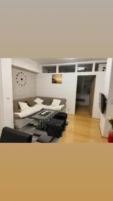 a living room with a couch and a table at Apartman Sara in Banja Luka