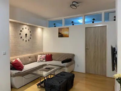 a living room with a couch and a table at Apartman Sara in Banja Luka