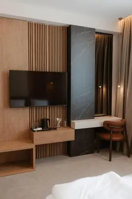 a hotel room with a large flat screen tv at Tradicija Hotel in Banja Luka