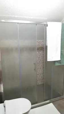 a bathroom with a glass shower with a toilet at Zem Zem kuća za odmor in Otoka