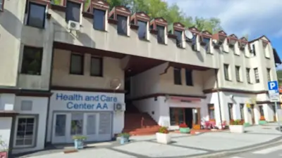 a large building with a health and care centeraza at Atika in Cazin