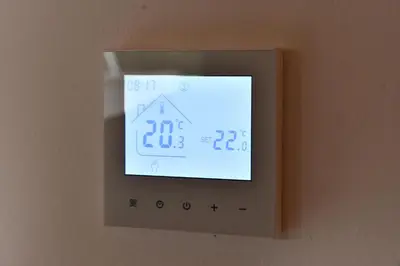 a lightswitch on a wall with a clock on it at Tasija Relax & Spa in Doboj