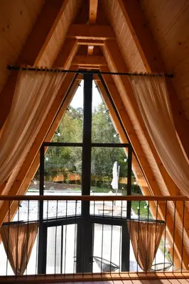 a large window in a room with a balcony at Tasija Relax & Spa in Doboj