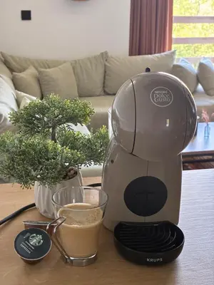 a coffee maker on a table with a cup of coffee at Forrest House in Doboj