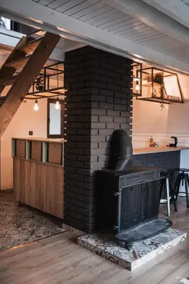 a brick oven in a room with a table and a counter at Forrest House in Doboj