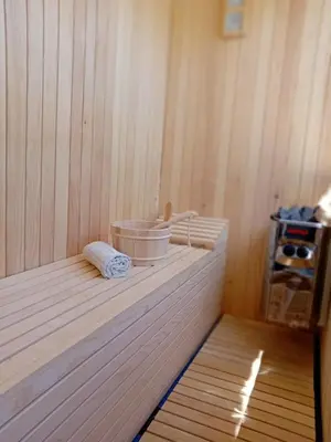 a corner of a sauna with a bucket on a shelf at Gyps Vikendica with Swimming Pool and Sauna 2 in Tuzla