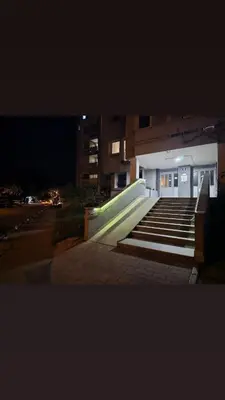 a group of stairs in front of a building at night at Ramonda Banja Luka in Banja Luka