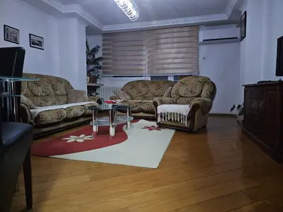 a living room with two couches and a table at Ramonda Banja Luka in Banja Luka