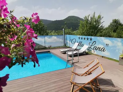 a deck with chairs and a swimming pool at Kuća za odmor Villa Lana Bihać in Bihać