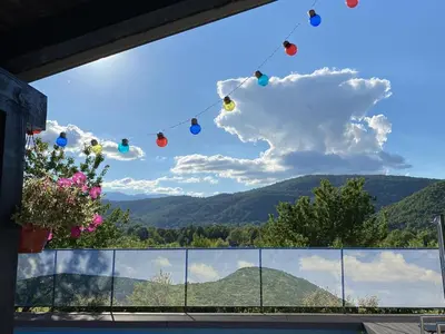 a window with a view of a mountain at Kuća za odmor Villa Lana Bihać in Bihać